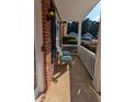 Inviting front porch with a chair, perfect for relaxing and enjoying the neighborhood views at 2435 Hickory Station Cir, Snellville, GA 30078