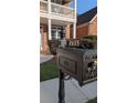 Close-up of a decorative mailbox with the house number '2435' displayed on a wrought iron post at 2435 Hickory Station Cir, Snellville, GA 30078