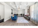 Bright living room featuring coffered ceilings, stylish furniture, and natural light at 349 Garnet Dr, Acworth, GA 30101