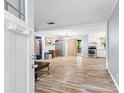 Open-concept living area featuring wood-look flooring and easy access to the kitchen at 3927 Buck Rd, Powder Springs, GA 30127