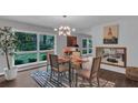 Dining room featuring modern lighting, large windows, and stylish decor at 2994 Baker Ridge Nw Dr, Atlanta, GA 30318