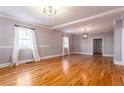 Large living room boasting hardwood floors, modern lighting, and fresh paint at 83 Ormond Se St, Atlanta, GA 30315