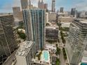 Beautiful aerial shot of the city buildings and a rooftop pool and greenery at 400 W Peachtree Nw St # 3711, Atlanta, GA 30308