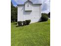 A side view of the house with well maintained lawn and mature landscaping at 199 Scenic View Ln, Stone Mountain, GA 30087