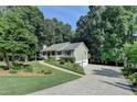 Traditional style home with a two-car garage and landscaped front yard at 1990 Holly Cove Rd, Cumming, GA 30040