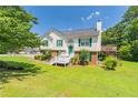 Inviting two-story home with a neatly landscaped front yard and an elevated deck at 2325 Sailor Ln, Suwanee, GA 30024