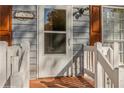 Close-up of front door with white frame and white painted railing at 7490 Hunters Ridge Dr, Douglasville, GA 30134