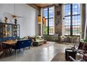 Open living area with exposed brick, high ceilings, large windows, and contemporary furnishings for a modern vibe at 170 Boulevard Se # 221E, Atlanta, GA 30312