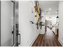 Contemporary hallway showcasing hardwood floors, sleek lighting, and bicycle rack at 12 Becker Nw Pl, Atlanta, GA 30307