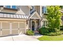 Charming two-story home with a well-manicured lawn, two-car garage, neutral siding, and black shutters at 1270 Briarwood Ne Rd, Atlanta, GA 30319