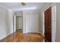 Welcoming foyer featuring hardwood floors, coat closet, and attractive trim work at 1956 Regents Way, Marietta, GA 30062