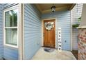 Inviting front door with a wreath, welcome sign, and charming exterior details at 4206 Mastic Pt # 24, Acworth, GA 30101