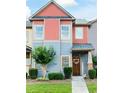 Townhouse with unique exterior featuring a welcoming entrance and landscaped front yard at 4206 Mastic Pt # 24, Acworth, GA 30101