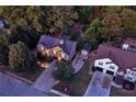 Aerial view showcases a beautiful home surrounded by mature trees and landscape at 1784 Virginia Grove Ln, Lawrenceville, GA 30045