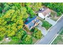 Beautiful home with mature trees and green landscaping from an aerial view at 1784 Virginia Grove Ln, Lawrenceville, GA 30045