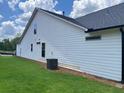 Exterior of home showing white siding and a well-maintained lawn at 301 Brooke View Trail, Canton, GA 30115