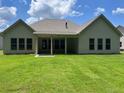 Exterior of home with covered porch and green lawn at 354 Brooke View Trail, Canton, GA 30115