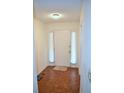 Inviting entryway with hardwood floors, a white door, and sheer curtains adding elegance and privacy at 1106 Shiloh Nw Ln, Kennesaw, GA 30144
