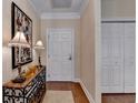 Hallway with hardwood floors, a decorative table and a closet with double doors at 5415 Northland Ne Dr # 303, Atlanta, GA 30342