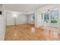 Open-concept living room with hardwood floors and natural light at 1504 Wingate Way, Atlanta, GA 30350