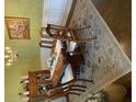 Traditional dining room featuring hardwood floors, elegant chandelier, and a classic area rug at 191 Baywood Way, Hiram, GA 30141