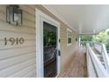 View of the porch showing the front door and the house numbers at 1910 Countryside Se Pl, Smyrna, GA 30080