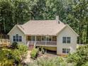 Beautiful home featuring stone accents, a covered porch, and mature landscaping for curb appeal at 217 Bridgewater Trl, Canton, GA 30115