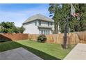 Well-maintained backyard features a basketball hoop and a wooden privacy fence at 2761 Valley Spring Dr, Lawrenceville, GA 30044