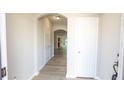 Bright entryway with wood-look floors leading to an open living area; fresh and welcoming at 3176 Creston Park Ct, Duluth, GA 30096