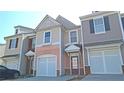 Well-maintained townhome showcasing integrated garages and inviting front entrances in a residential community at 3176 Creston Park Ct, Duluth, GA 30096