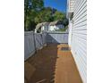 Private patio area enclosed by a wooden fence, perfect for outdoor relaxation and entertainment at 22 Fairview Dr, Jonesboro, GA 30238