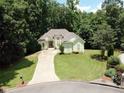 Aerial shot of a home surrounded by mature trees, offering privacy at 235 Pirkle Ct, Cumming, GA 30040