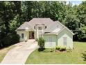 Lovely single-Gathering home featuring a lush lawn and inviting curb appeal at 235 Pirkle Ct, Cumming, GA 30040