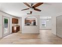 Open-concept living room with wood floors and a view into the kitchen and dining area at 2714 Haynescrest Dr, Grayson, GA 30017