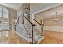 Bright open floor plan with elegant staircase and hardwood floors at 6010 Somerset Ct, Suwanee, GA 30024
