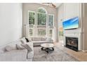 Inviting living room with soaring ceilings, fireplace, and large windows at 2720 Stillwater Lake Ln, Marietta, GA 30066