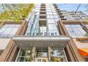 Viewpoint building entrance featuring modern architecture and retail storefronts at 855 Peachtree Ne St # 3304, Atlanta, GA 30308