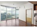 Bright living room with hardwood floors, city views, and modern finishes at 855 Peachtree Ne St # 3304, Atlanta, GA 30308