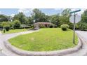 Brick home on a corner lot with a well-kept lawn and a convenient carport at 2880 Sherwood Se Rd, Smyrna, GA 30082