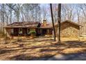 Charming stone and wood home with a well-maintained front yard and inviting entrance, perfect for curb appeal at 166 Muse Rd, Fayetteville, GA 30214