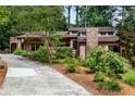 Well-maintained home with stone chimney, beautiful landscaping, and inviting curb appeal at 3152 Sycamore Ln, Marietta, GA 30066