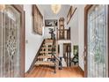 Stunning foyer with wood floors, glass-accented doors, and elegant staircase at 3152 Sycamore Ln, Marietta, GA 30066
