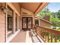 Inviting front porch with double doors, large windows, and a cozy bench at 3152 Sycamore Ln, Marietta, GA 30066