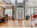 Open entryway with hardwood floors, chandelier, high ceilings, and front door with sidelights at 2875 Daniel Park Run, Dacula, GA 30019