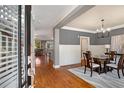 Elegant dining room with hardwood floors, modern chandelier, and stylish furnishings at 1604 Gilstrap Nw Ln, Atlanta, GA 30318