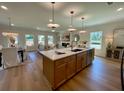 Open-concept kitchen features a center island, modern appliances, and a seamless flow to the dining area at 304 Marigold Ln, Woodstock, GA 30188