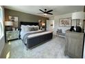 Comfortable and stylish main bedroom features a plush bed, neutral decor, and ample space at 304 Marigold Ln, Woodstock, GA 30188