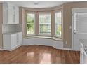 Cozy breakfast nook features a bay window seat and natural light, perfect for enjoying your morning coffee at 3725 Crescent Walk Ln, Suwanee, GA 30024