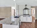 Bright kitchen with stainless steel appliances, granite countertops, and a sleek island with sink at 3725 Crescent Walk Ln, Suwanee, GA 30024