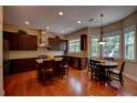 Well-lit kitchen with granite countertops, an island, and stainless steel appliances at 1622 Rivergreen Se Bnd # 26, Atlanta, GA 30339